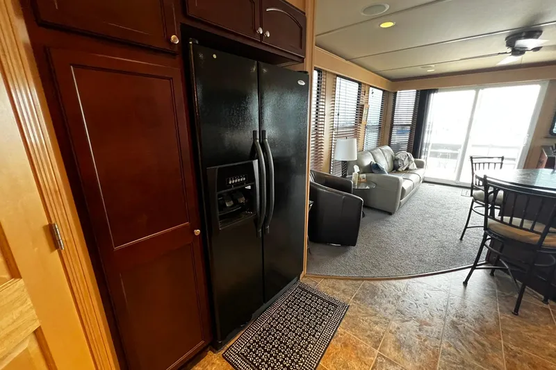Slide: The Image of Luxurious Skipperliner 480 Flybridge interior with modern kitchen and cozy living area, 2010 model. - 26