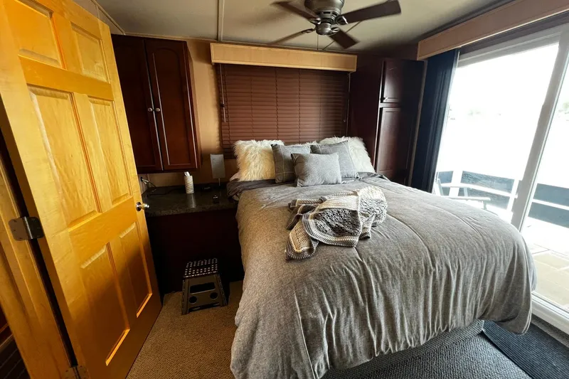 Slide: The Image of Cozy bedroom in 2010 Skipperliner 480 Flybridge with plush bedding and modern decor. - 35