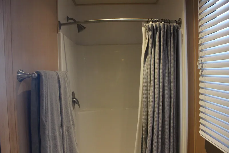 Slide: The Image of Shower area in 2010 Skipperliner 480 Flybridge with curtain and towel. - 38