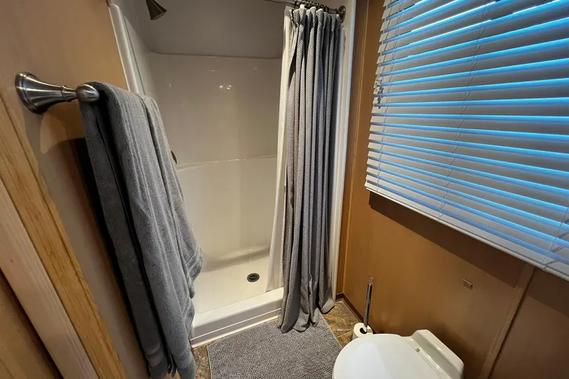 Slide: The Image of Bathroom interior of 2010 Skipperliner 480 Flybridge with shower and toilet. - 39
