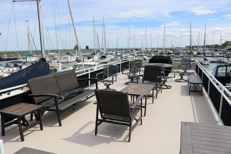 Slide: The Image of Spacious deck of 2010 Skipperliner 480 Flybridge with outdoor seating, overlooking marina. - 44
