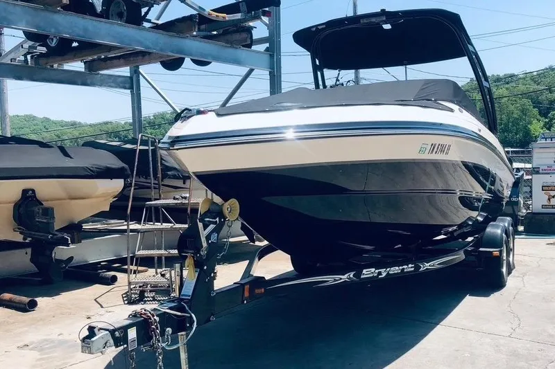 Slide: The Image of 2013 Bryant 210 Walkabout boat on trailer in marina storage area. - 1