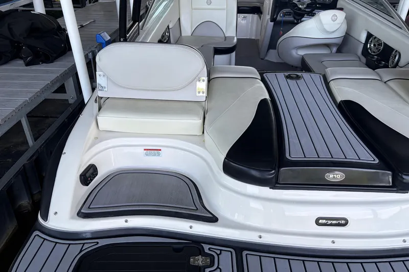 Slide: The Image of 2013 Bryant 210 Walkabout boat interior with sleek seating and modern design. - 9