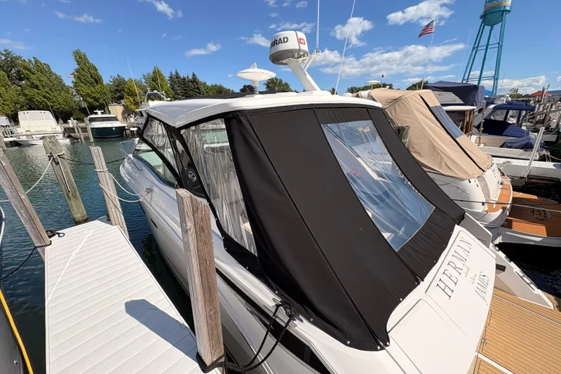 The Image of 2019 Sea Ray Sundancer 320 docked at marina with clear skies. - 0