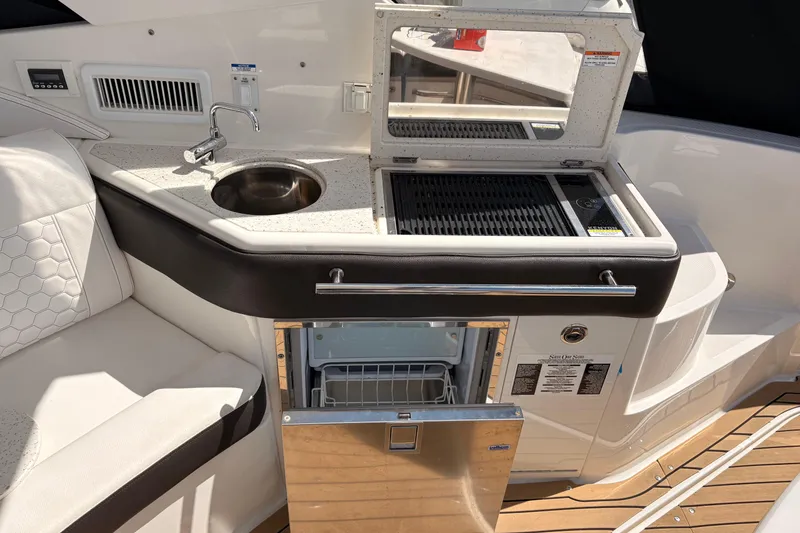 Slide: The Image of Outdoor kitchenette on 2019 Sea Ray Sundancer 320 yacht with sink, grill, and fridge. - 8