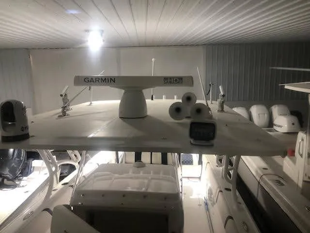 Slide: The Image of 2019 Midnight Express 39 Cuddy boat with Garmin radar in a storage facility. - 3
