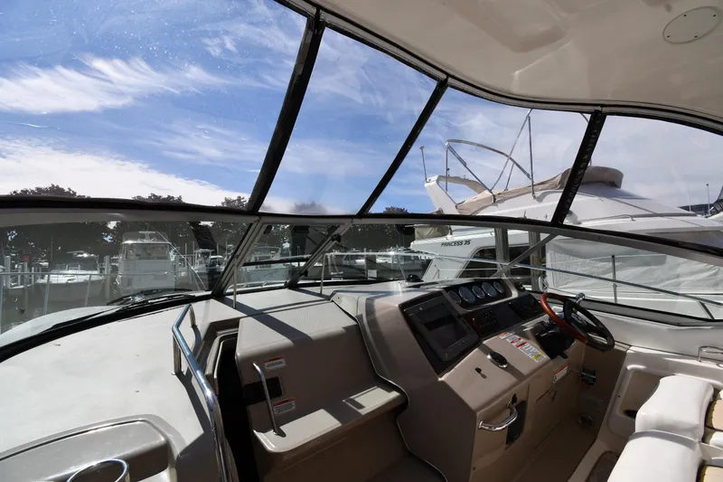 Slide: The Image of Interior view of 2008 Sea Ray Sundancer 350 yacht cockpit with steering wheel and dashboard. - 10
