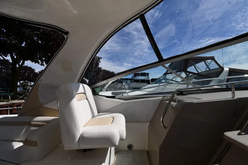 Slide: The Image of Interior view of 2008 Sea Ray Sundancer 350 yacht with plush seating and large windows. - 15