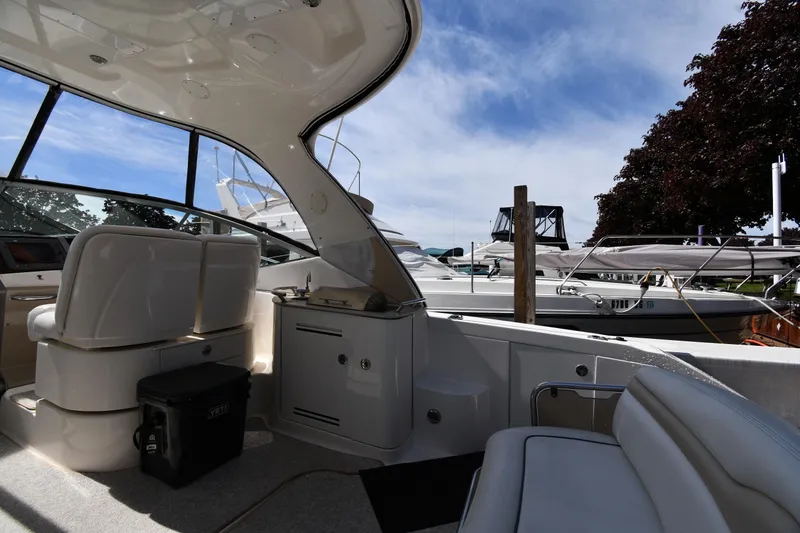 Slide: The Image of Interior view of a 2008 Sea Ray Sundancer 350 yacht docked at a marina. - 16