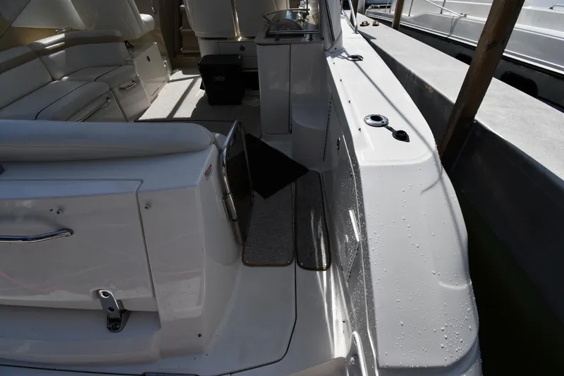 Slide: The Image of Interior view of a 2008 Sea Ray Sundancer 350 yacht, featuring seating and deck area. - 21