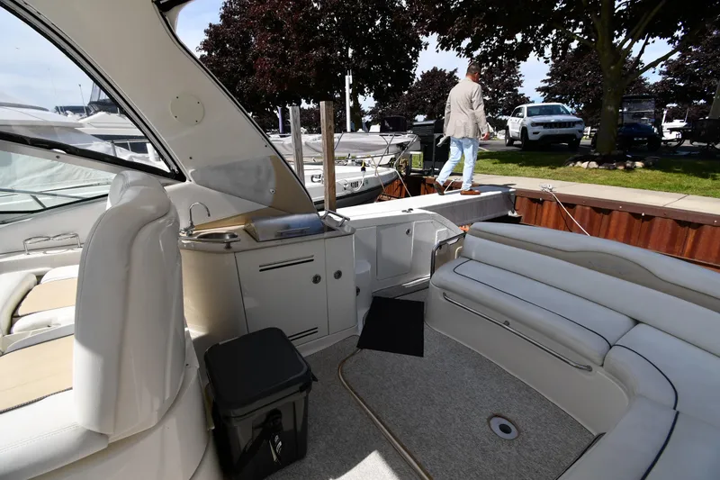 Slide: The Image of 2008 Sea Ray Sundancer 350 interior with seating and dock view. - 24