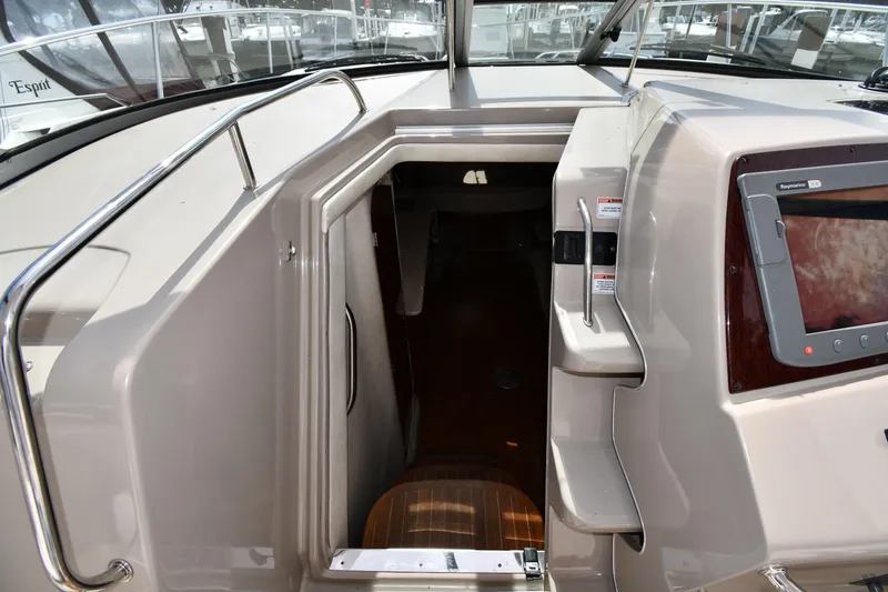 Slide: The Image of 2008 Sea Ray Sundancer 350 cabin entrance with control panel and steps. - 26