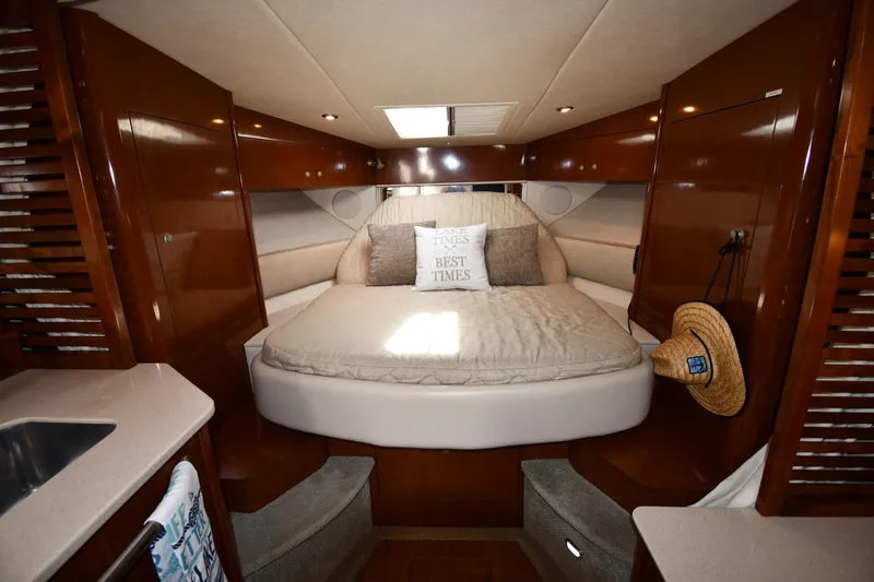 Slide: The Image of Luxurious cabin interior of 2008 Sea Ray Sundancer 350 yacht with cozy bed and wooden finish. - 27