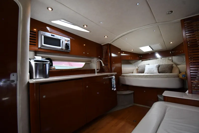 Slide: The Image of Luxurious interior of 2008 Sea Ray Sundancer 350 yacht with kitchenette and cozy sleeping area. - 32