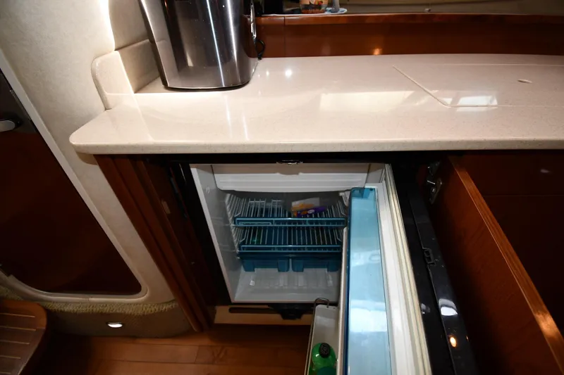 Slide: The Image of Interior of 2008 Sea Ray Sundancer 350 showing open mini fridge and countertop. - 37