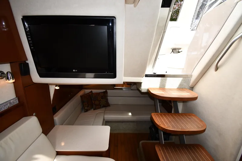 Slide: The Image of Interior of 2008 Sea Ray Sundancer 350 yacht with TV, seating, and wooden steps. - 41