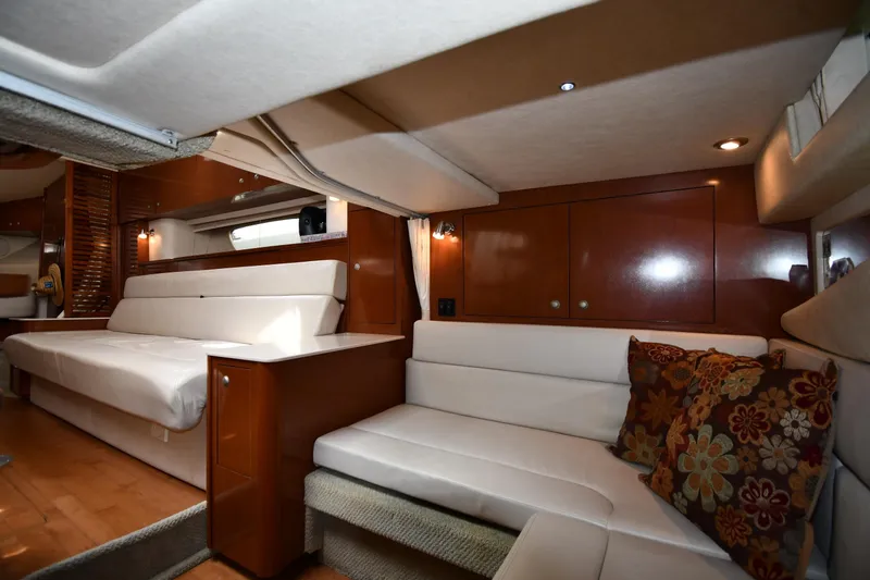 Slide: The Image of Luxurious interior of 2008 Sea Ray Sundancer 350 yacht with plush seating and elegant wood finishes. - 42