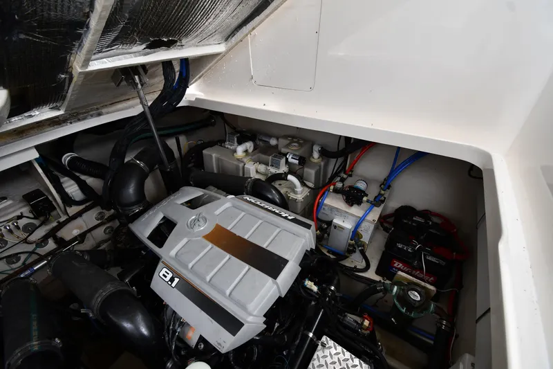 Slide: The Image of Engine compartment of a 2008 Sea Ray Sundancer 350 boat, showcasing mechanical components. - 48