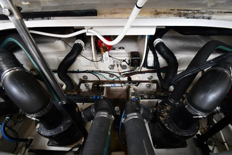 Slide: The Image of Engine compartment of a 2008 Sea Ray Sundancer 350 with visible hoses and wiring. - 50