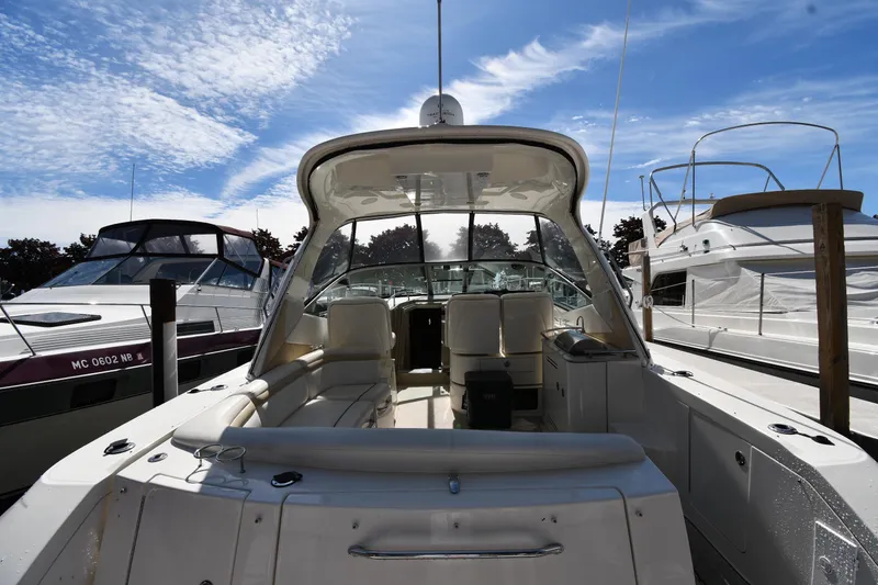 Slide: The Image of 2008 Sea Ray Sundancer 350 yacht docked under a clear blue sky. - 9