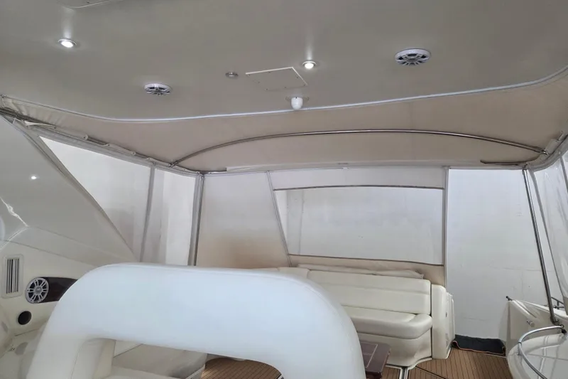 Slide: The Image of Interior view of 2000 Sea Ray Sundancer 540 yacht with seating and canopy. - 13