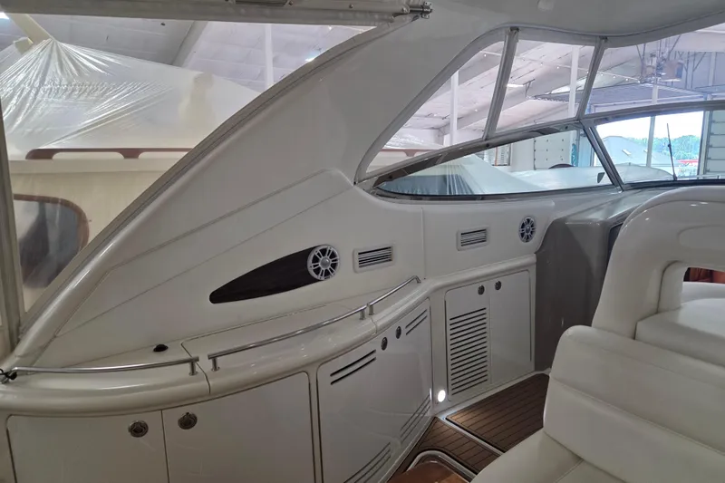 Slide: The Image of Interior view of a 2000 Sea Ray Sundancer 540 yacht, showcasing sleek design and seating. - 14