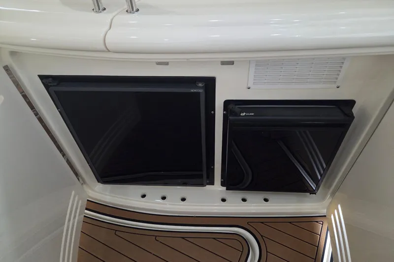 Slide: The Image of Interior view of a 2000 Sea Ray Sundancer 540 yacht, featuring built-in appliances. - 16