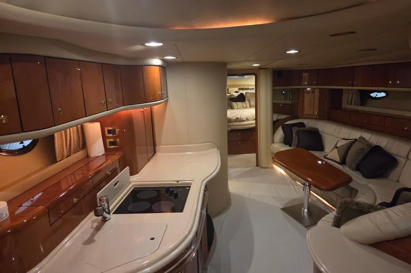 Slide: The Image of Luxurious interior of a 2000 Sea Ray Sundancer 540 yacht with elegant wood finishes. - 20