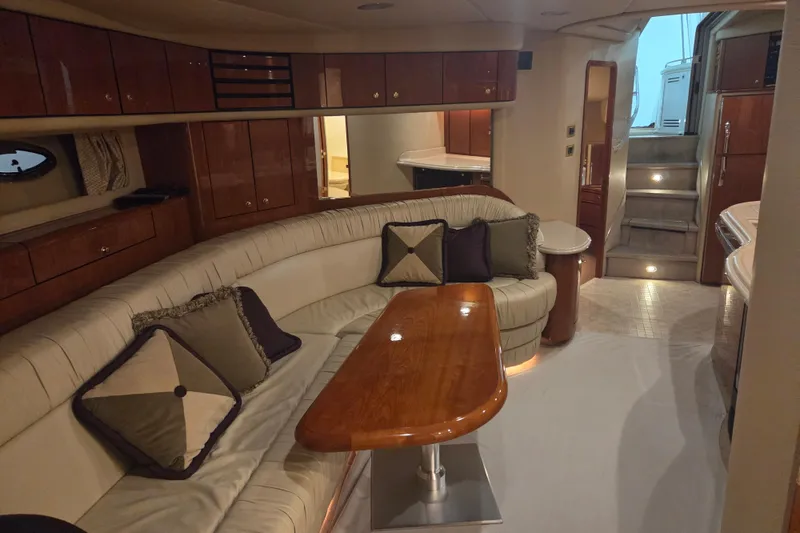 Slide: The Image of Luxurious interior of a 2000 Sea Ray Sundancer 540 yacht with elegant seating and wooden accents. - 21