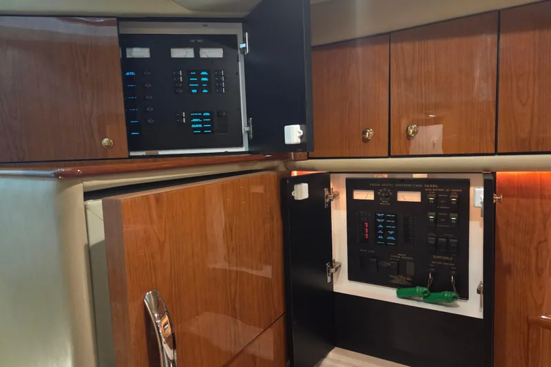Slide: The Image of Electrical control panels inside a 2000 Sea Ray Sundancer 540 yacht cabin. - 22