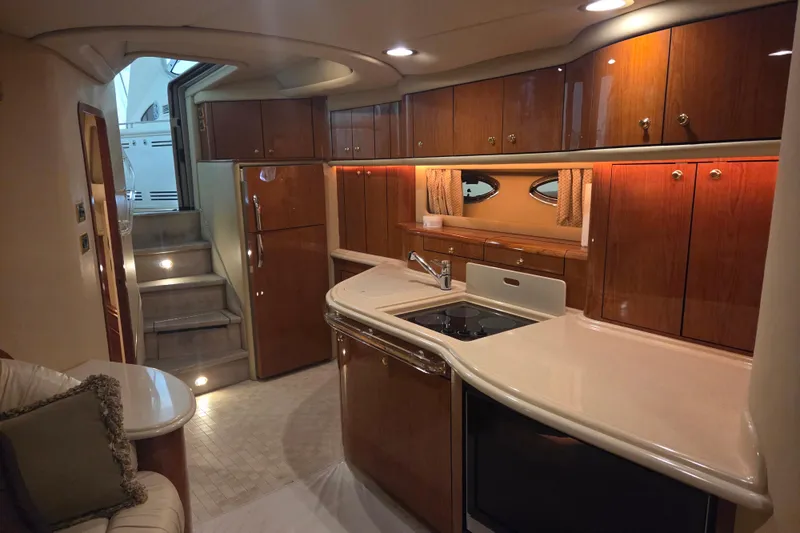Slide: The Image of Luxurious interior of 2000 Sea Ray Sundancer 540 yacht with elegant wood cabinetry. - 24