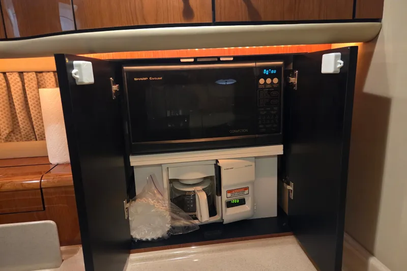 Slide: The Image of Microwave and coffee maker inside Sea Ray Sundancer 540 yacht's kitchen cabinet, 2000 model. - 28