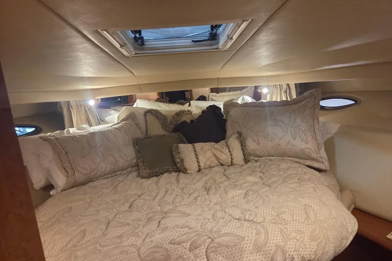Slide: The Image of Luxurious cabin interior of 2000 Sea Ray Sundancer 540 yacht with plush bedding. - 32