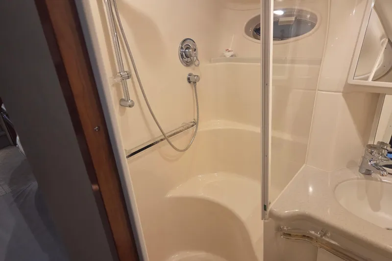 Slide: The Image of Bathroom interior of 2000 Sea Ray Sundancer 540 yacht, featuring shower and sink. - 34
