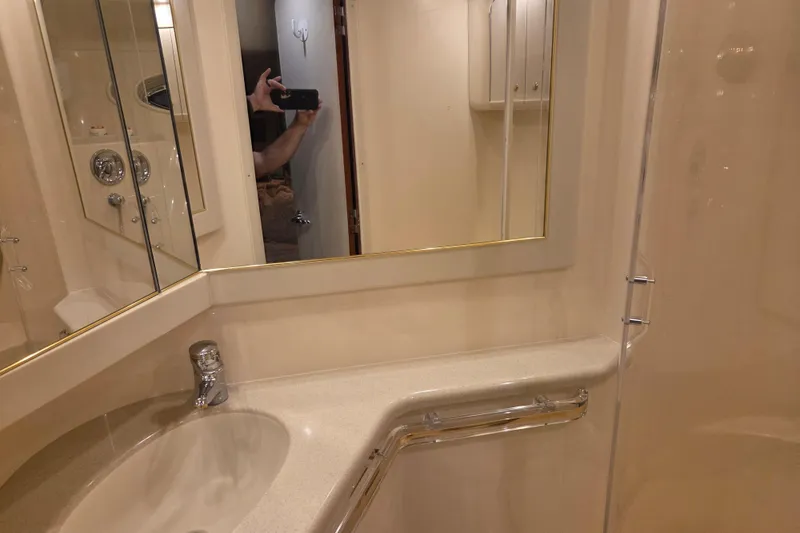 Slide: The Image of Bathroom interior of 2000 Sea Ray Sundancer 540 yacht, featuring sink and mirror. - 35