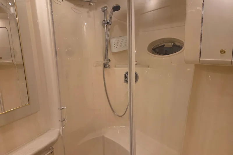 Slide: The Image of Luxurious bathroom interior of 2000 Sea Ray Sundancer 540 yacht with shower and porthole. - 36