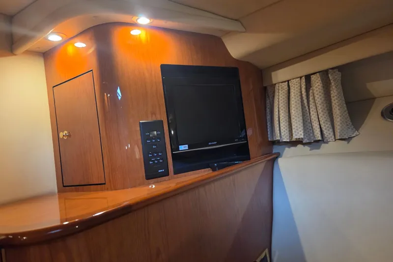 Slide: The Image of Interior of 2000 Sea Ray Sundancer 540 yacht with TV and wood paneling. - 39