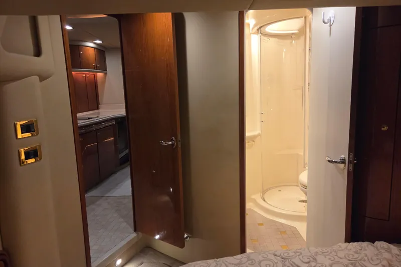 Slide: The Image of Interior of 2000 Sea Ray Sundancer 540 yacht, featuring a bathroom and kitchen area. - 41