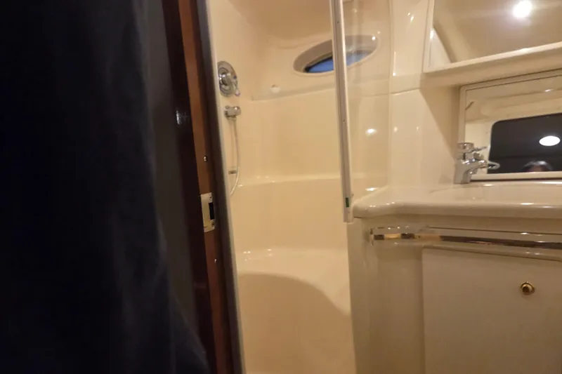 Slide: The Image of Bathroom interior of 2000 Sea Ray Sundancer 540 yacht, featuring shower and sink. - 42