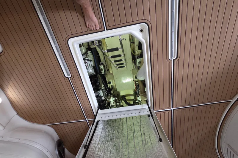 Slide: The Image of Engine compartment of a 2000 Sea Ray Sundancer 540 yacht with wooden deck flooring. - 43