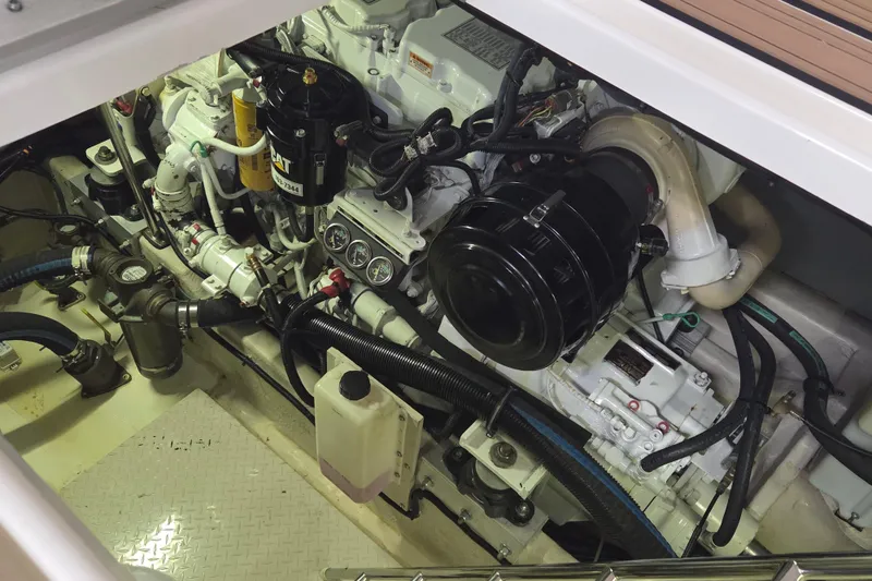 Slide: The Image of Engine compartment of a 2000 Sea Ray Sundancer 540 yacht, showcasing detailed machinery. - 44