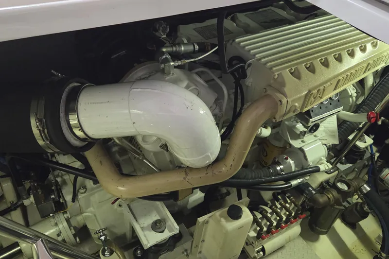 Slide: The Image of Engine compartment of a 2000 Sea Ray Sundancer 540 yacht, featuring CAT Marine Power components. - 47