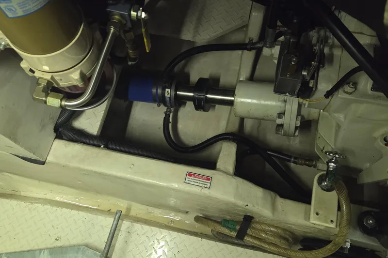 Slide: The Image of Engine compartment of a 2000 Sea Ray Sundancer 540 boat, showing mechanical components. - 48