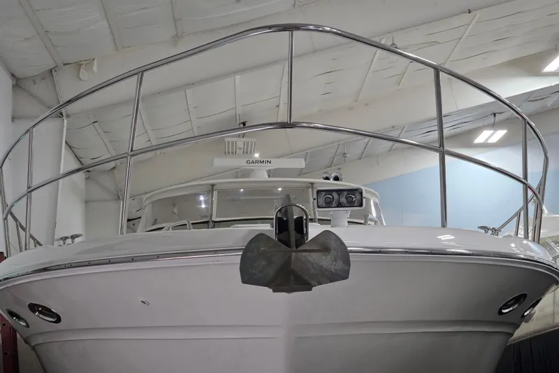 Slide: The Image of Front view of a 2000 Sea Ray Sundancer 540 yacht in a storage facility. - 56