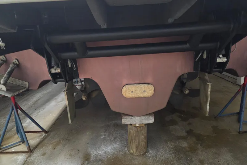 Slide: The Image of Rear view of a 2000 Sea Ray Sundancer 540 boat on stands. - 61