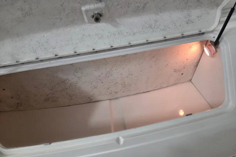 Slide: The Image of Open storage compartment with light inside a 2000 Sea Ray Sundancer 540 boat. - 64