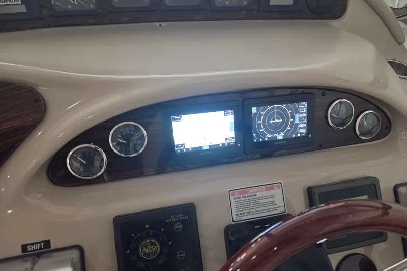 Slide: The Image of Control panel of a 2000 Sea Ray Sundancer 540 with Garmin navigation displays. - 65