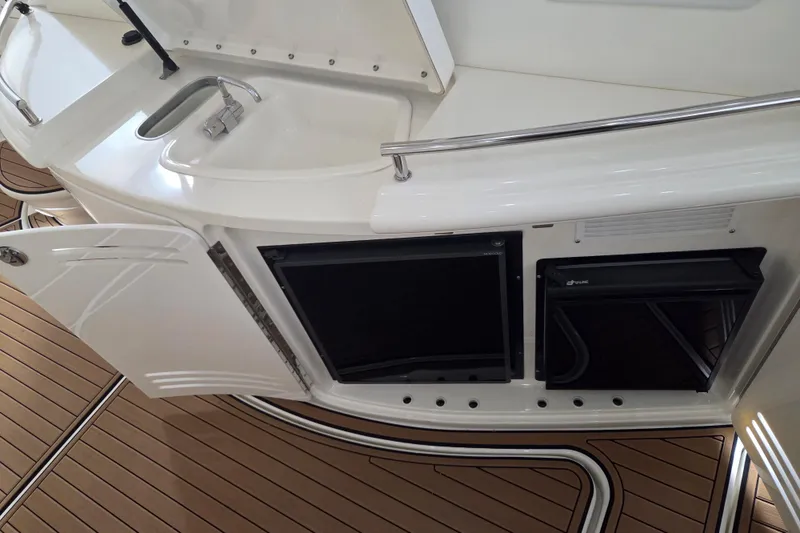 Slide: The Image of Interior view of 2000 Sea Ray Sundancer 540 yacht with sink and storage. - 66