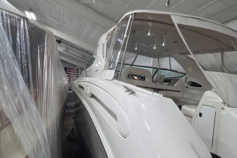 Slide: The Image of 2000 Sea Ray Sundancer 540 yacht in storage, covered and well-maintained indoors. - 67
