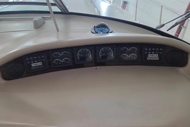Slide: The Image of Dashboard of a 2000 Sea Ray Sundancer 540 boat with gauges and controls. - 70